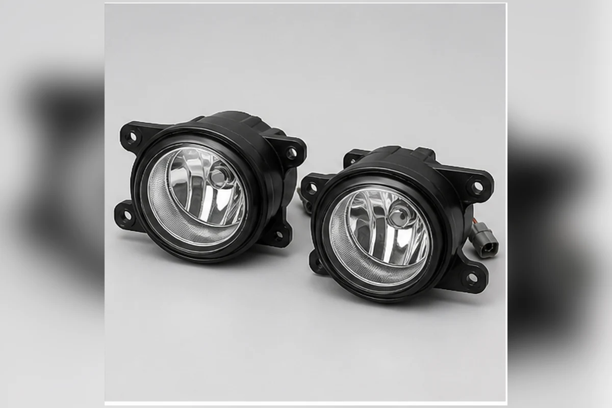 Pair of fog-light assemblies with clear lenses, reflectors, housings and mounting ears