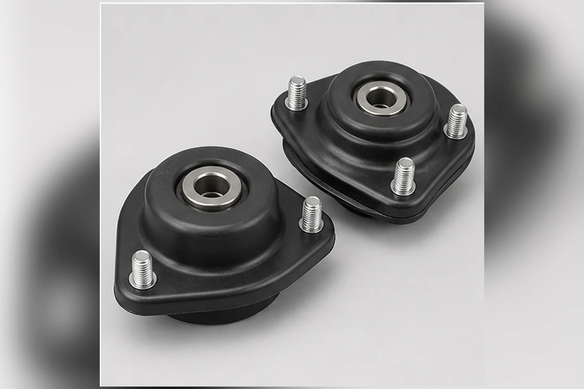 Pair of front strut top mounts with rubber isolators, metal plates and center bearings