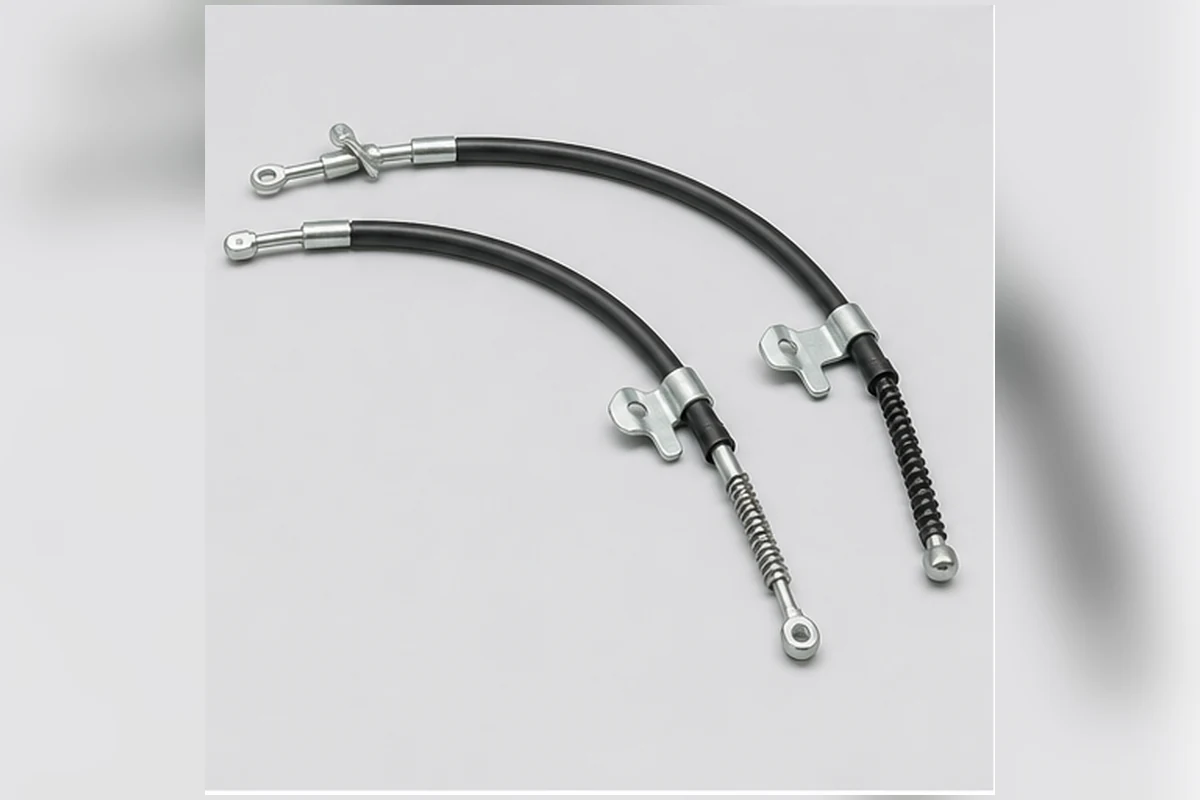 Pair of parking-brake cables with sheaths, mounting clips and distinct end fittings